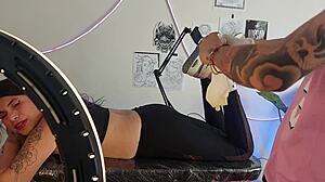 Tattoo session with fingering included by skilled artist