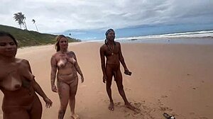 Couple enjoys beach time in front of friends